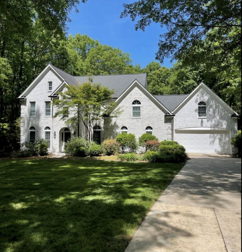 Professional Limewash Brick Home in Charlotte, NC Beautiful Charlotte home featuring a professional limewash brick finish, showcasing a soft, elegant whitewashed look with enhanced texture and curb appeal.