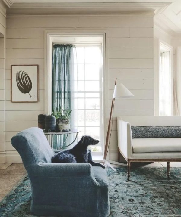 Living room showcasing the outdated all-beige color trend with matching walls, trim, and furnishings