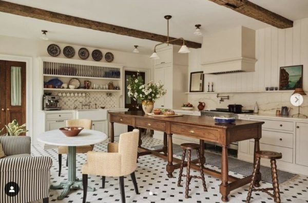 Stark white living space with all-white walls and furnishings, illustrating the fading 2025 trend of ultra-bright whites that designers are replacing with warmer, grounded neutrals.