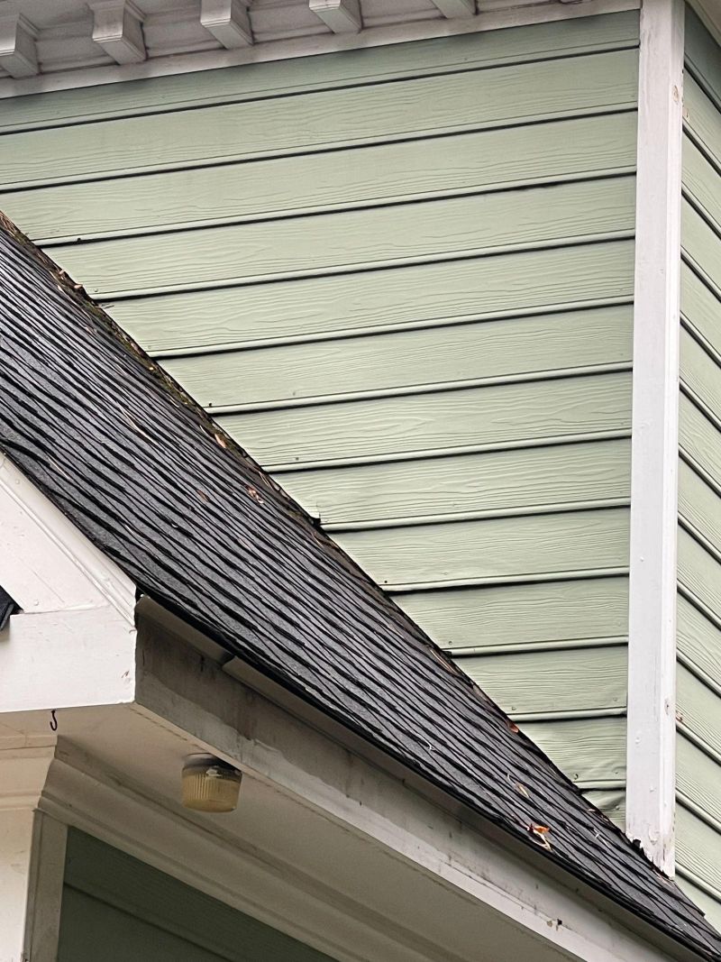 Early Exterior Wood Damage from Deferred Maintenance Painting in Charlotte Early signs of exterior wood deterioration on a Charlotte home caused by delayed maintenance painting