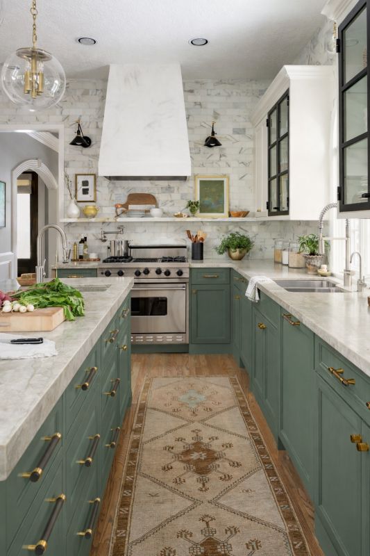 Professional Kitchen Cabinet Painting and Refinishing Process Kitchen with professionally painted green cabinets showing the quality finish achieved through detailed cabinet painting and refinishing